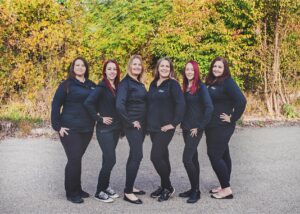 Six of our staff members posing for a group photo.