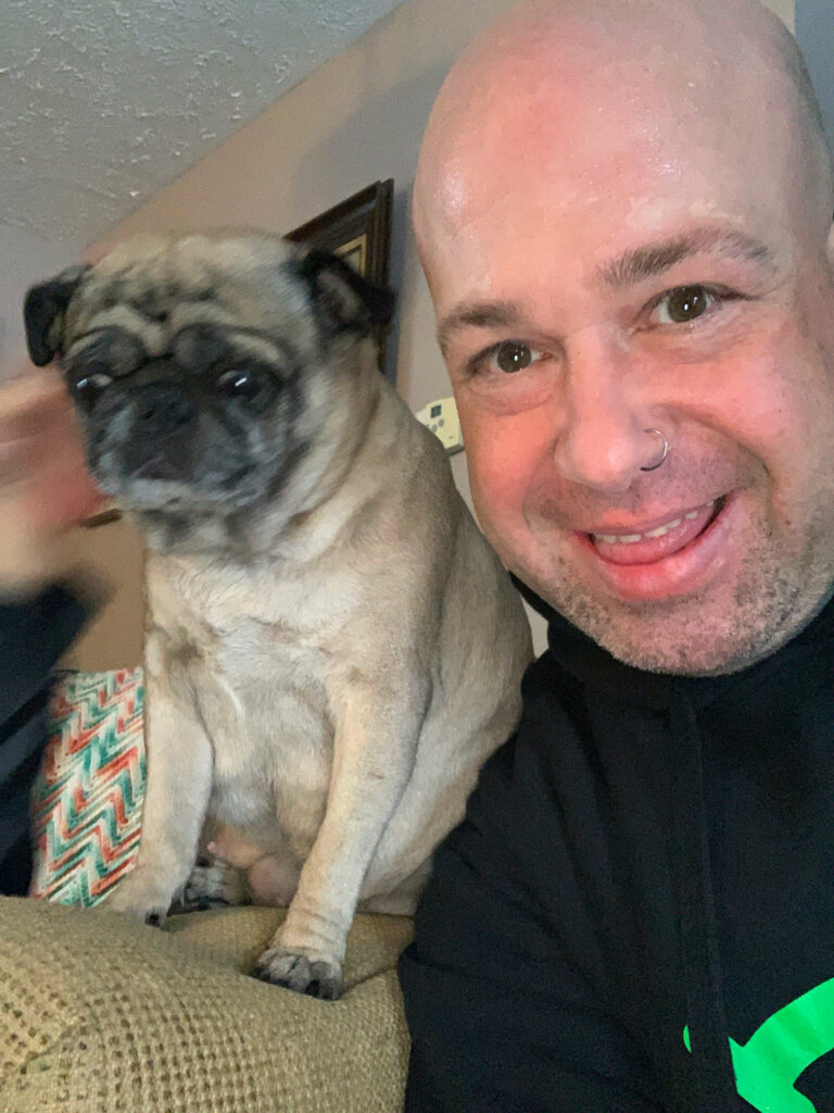 One of our Pest Pros technicians posing side by side with his dog, symbolizing the pet-friendly approach to pest control.